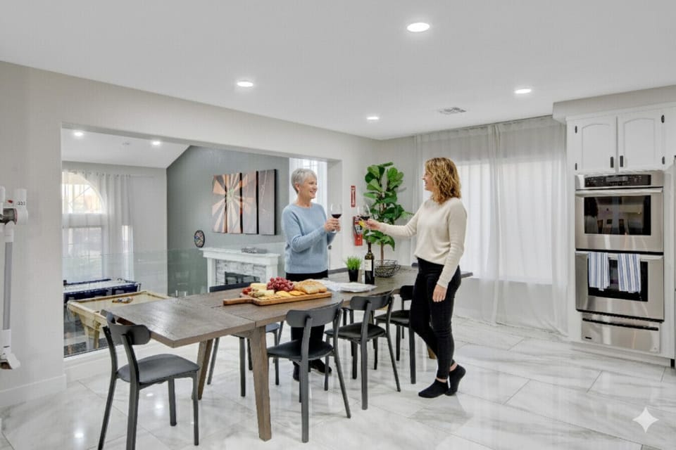 A mother and daughter, wine glasses in hand, catching up at last,  this is what it`s all about. Cozy nights, deep conversations, and the rare joy of having everyone you love under one roof. Our home was made for these moments (Table can sit 12 Adults)