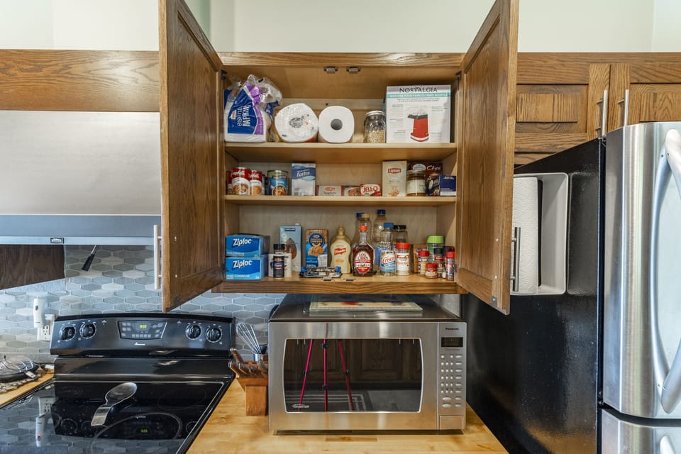 We keep a fairly well-stocked pantry for guest use.  Help yourself.