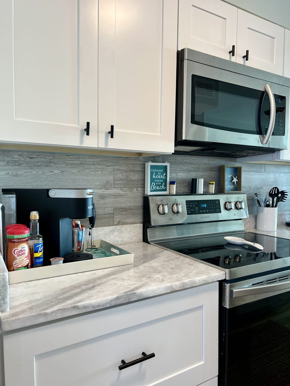 Galley kitchen well stocked. 