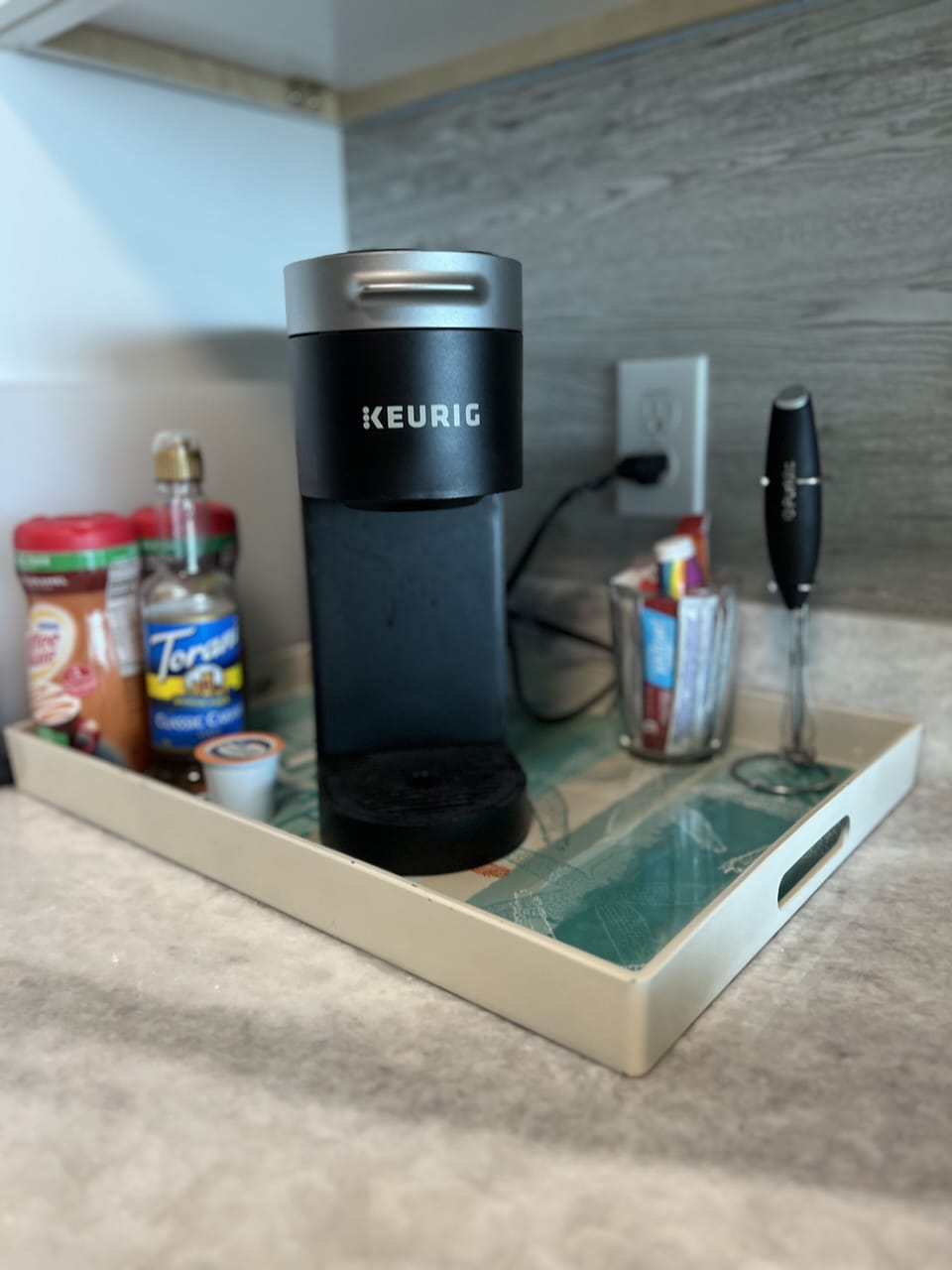 Coffee station with Keurig there is a standard drip maker in the drawer beneath.