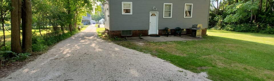 Large yard with long driveway.