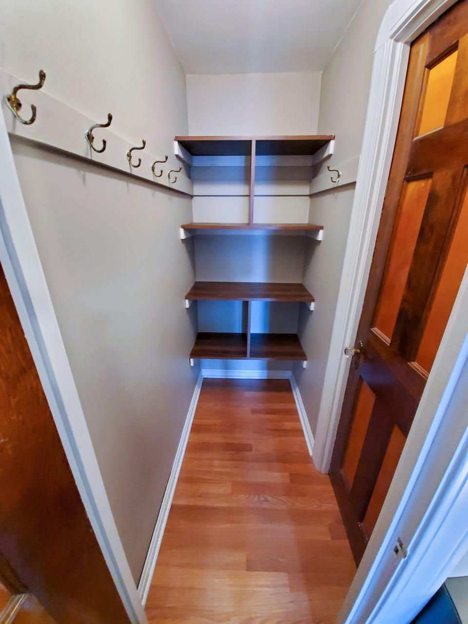 Large walk in closet with shelves & hooks. Second closet has hanging space also!