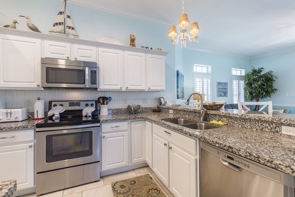 Kitchen is fully stocked with pots, pans, and cooking utensils!