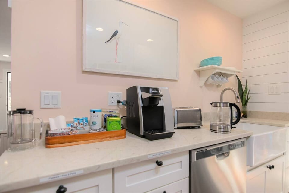 Well-equipped kitchen with plumbed Keurig, French press, electric kettle,  toaster, and more.