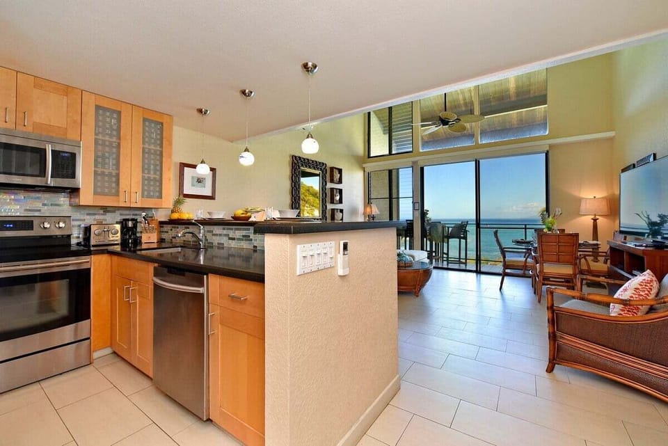 Enjoy a kitchen that keeps you in the conversation. Modern appliances and an open layout ensure you never lose sight of that beautiful ocean horizon while preparing meals.