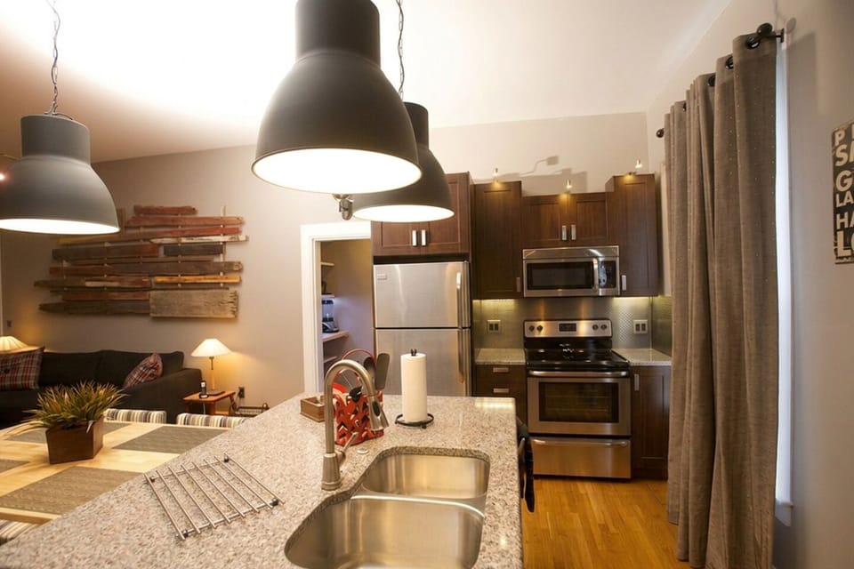Kitchen island features a double sink and a very quiet dishwasher (about 50 db)