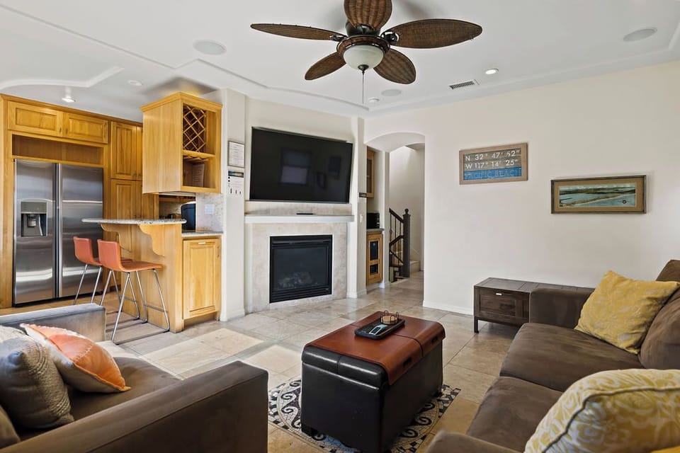 living area on main level with 65" Samsung Smart TV