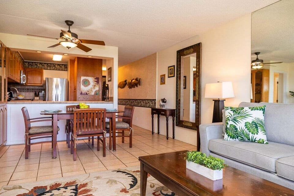 Comfortable living room with ceiling fan and seating for gathering.