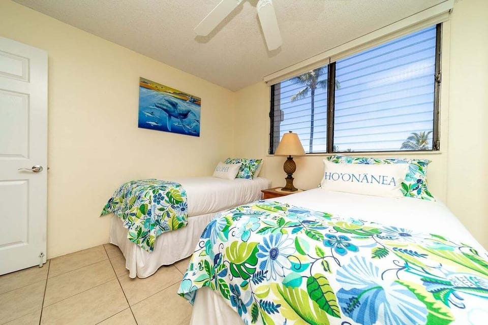 Comfortable twin bedroom with garden views and flexible sleeping setup.
