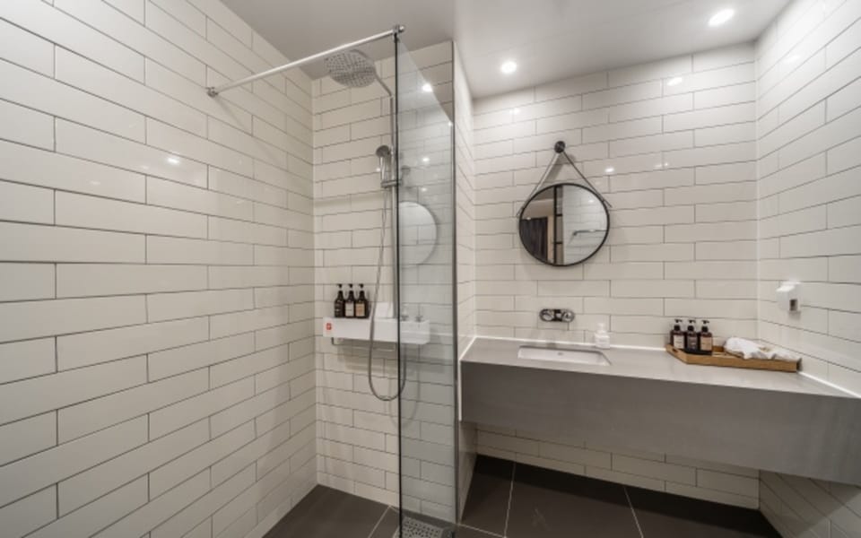 Separate tub and shower, rainfall showerhead, free toiletries