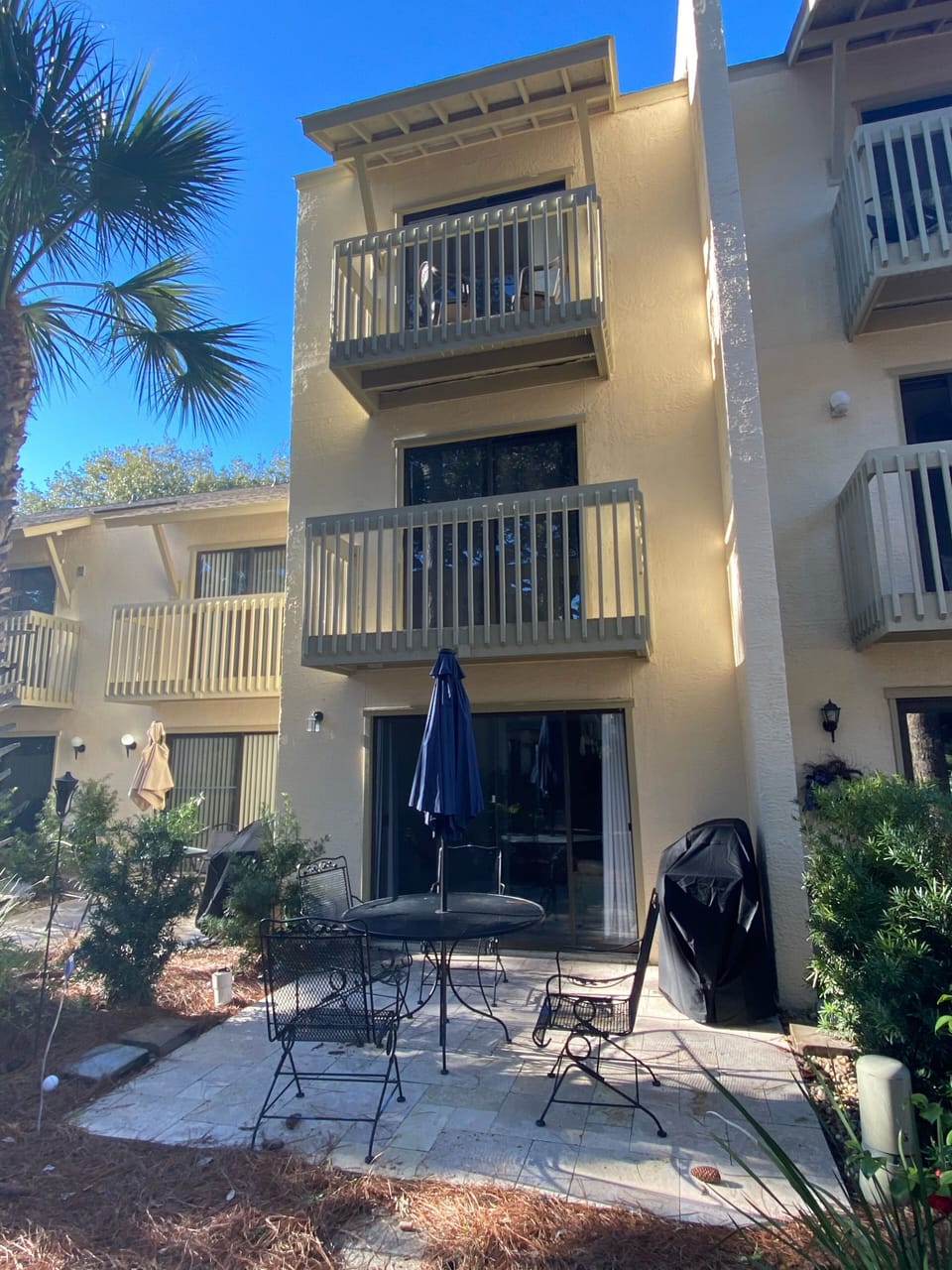 Patio with table and gas grill 