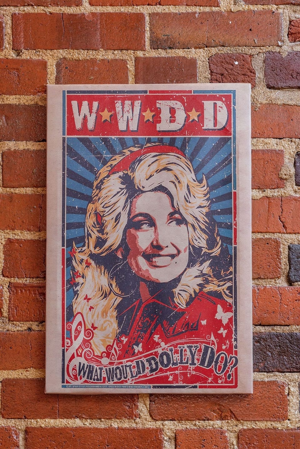 - Colorful Dolly artwork adds fun Nashville charm to the exposed brick   - Bold design brings personality and a pop of energy to the space   - Unique detail guests love capturing during their stay