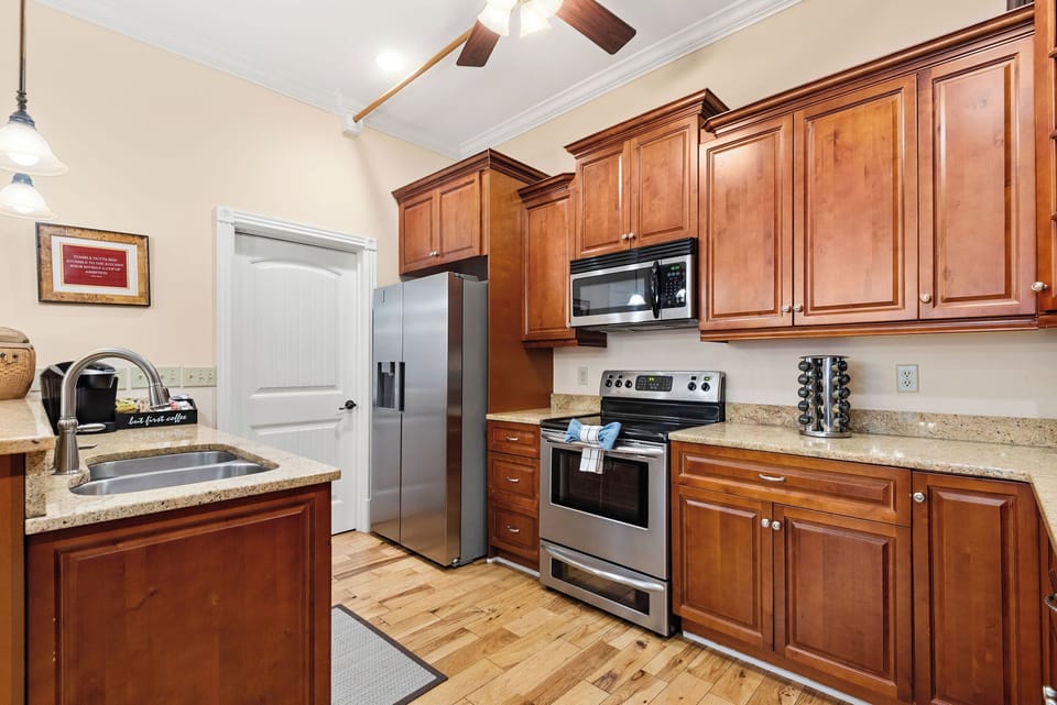 - Fully equipped kitchen with stainless appliances and spacious countertops   - Warm wood cabinetry creates a comfortable and functional cooking setup   - Perfect space for preparing meals during your Nashville getaway