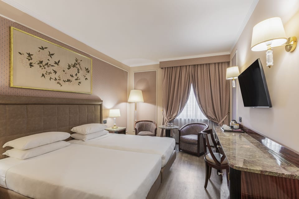 Classic Twin Room | Living area | 26-inch LCD TV with satellite channels, TV