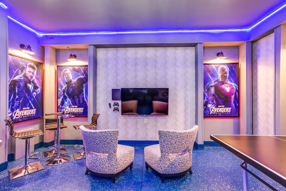 View 2 of amazing arcade room with game consoles, foosball, ping pong table, and air hockey
