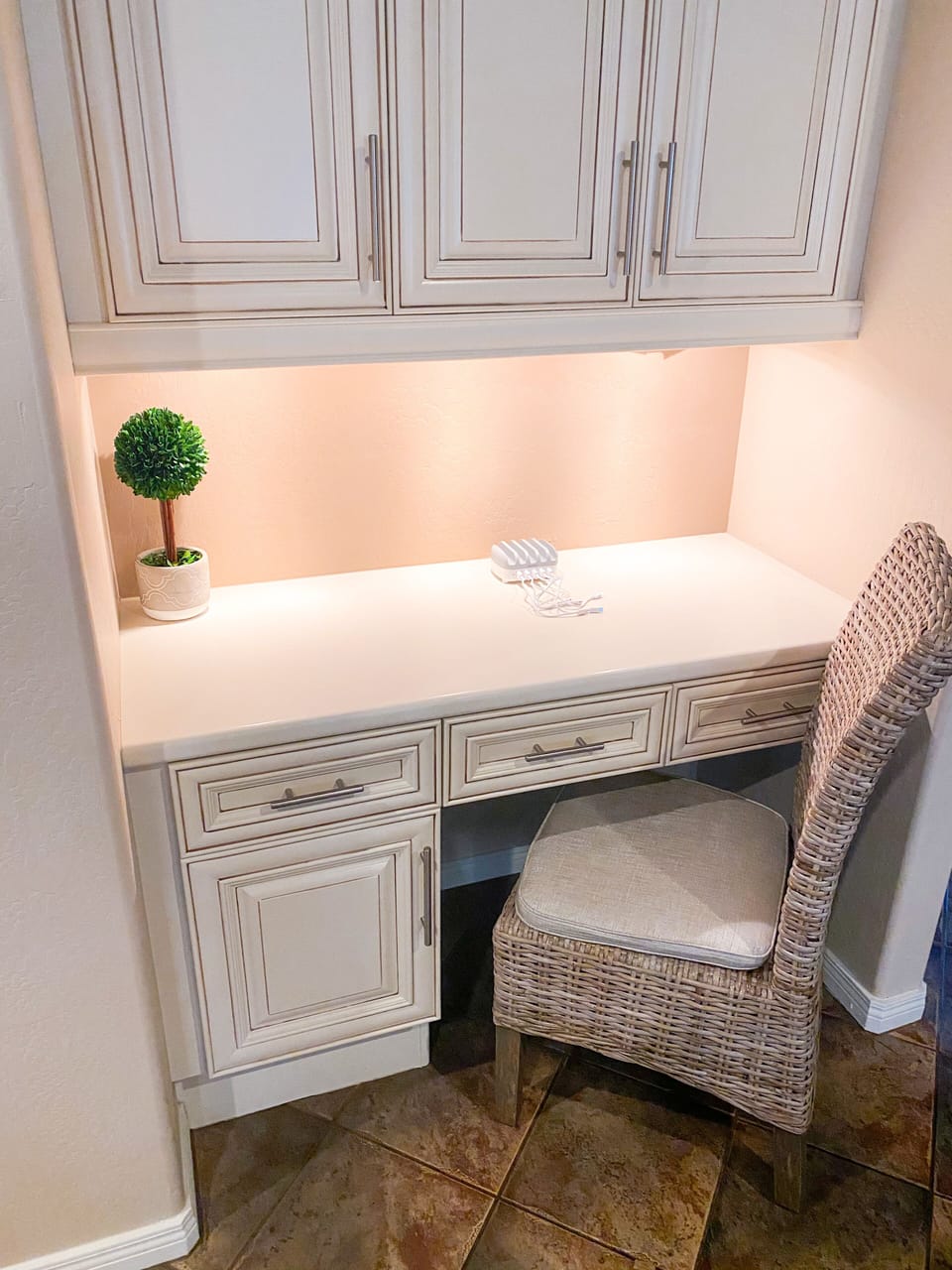 Desk space in living room w/charging station.