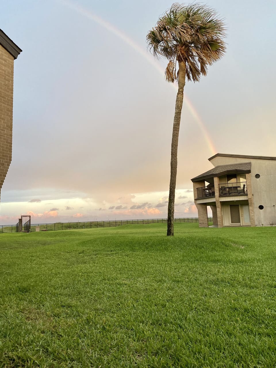 View of rainbow over ocean from back porch