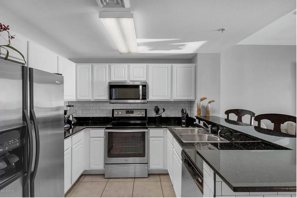 Your fully equipped kitchen features granite counters, stainless steel appliances, and everything needed for home-cooked meals.