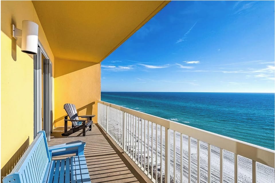 Step onto your private oceanfront balcony where comfortable seating awaits and endless sea views stretch to the horizon.