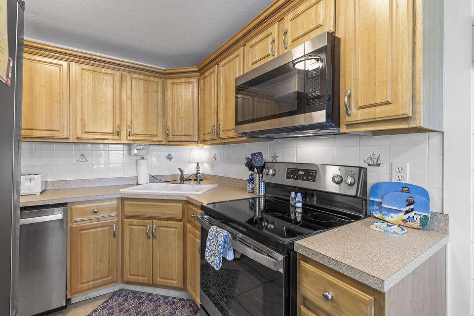Fully Stocked Kitchen with New Stainless Steel Appliances