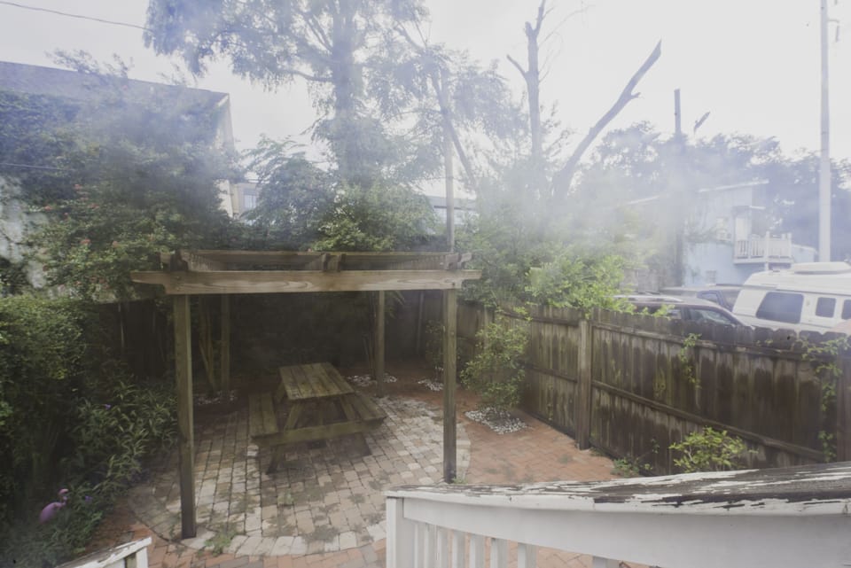The backyard is fenced in for privacy.