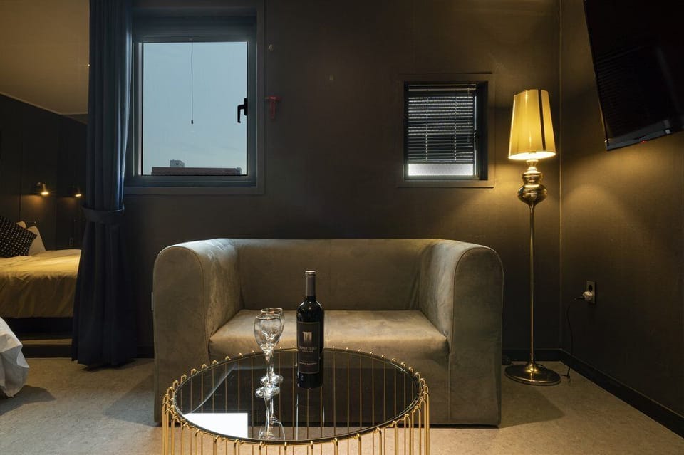 Mirror | Premium bedding, desk, laptop workspace, soundproofing