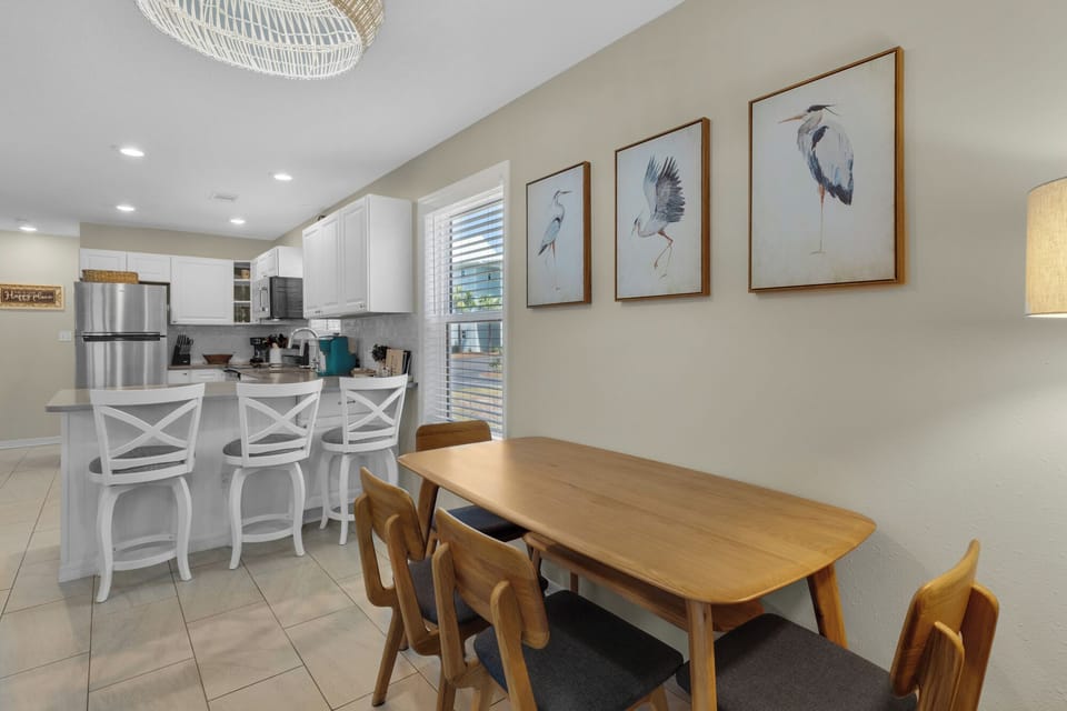 Dining room layout for 6 with bench seating, and 3 additional at the island