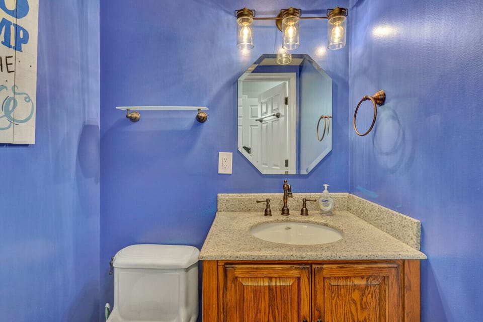 Conveniently placed half bath in the hall, perfect for quick access and guest use.