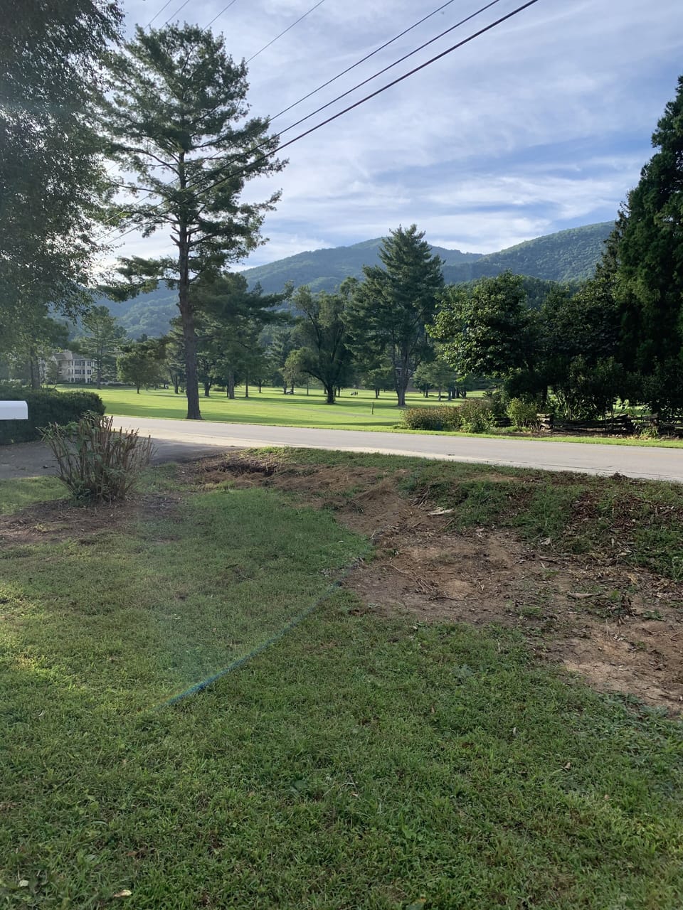 View from front yard city golf course and mountains