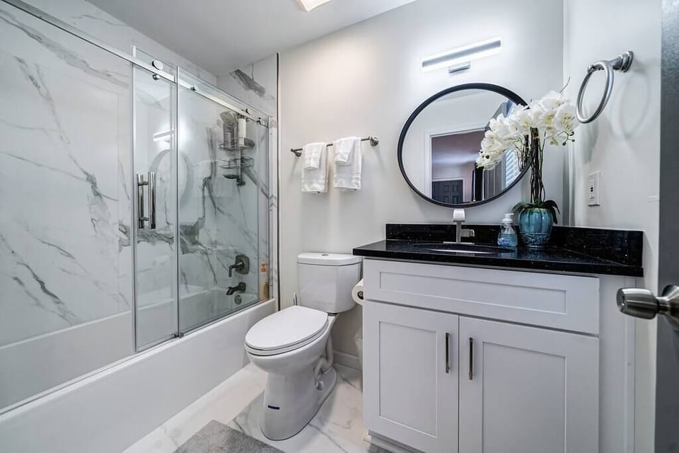 Guest room 1: private full bathroom.