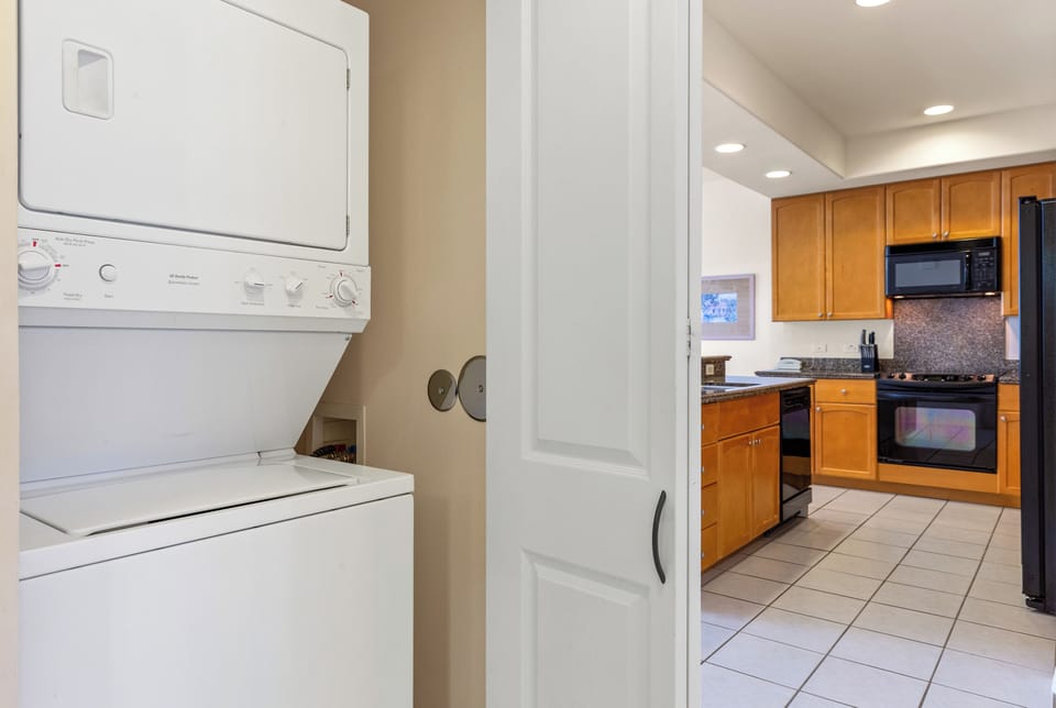 Your laundry convenience meets a fully equipped kitchen—washer, dryer, and everything you need for comfortable, home-style living during your stay.