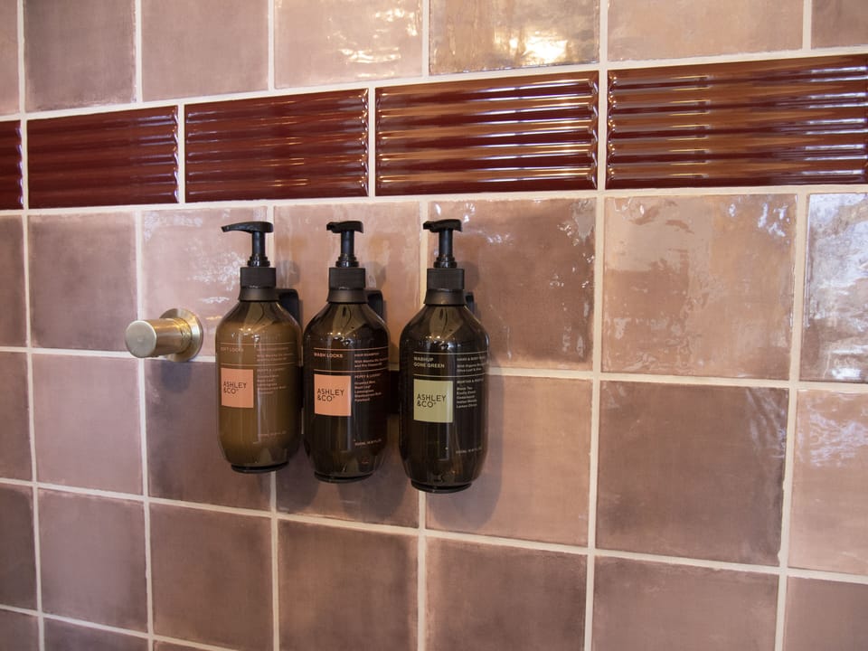 Designer toiletries, hair dryer, towels, soap