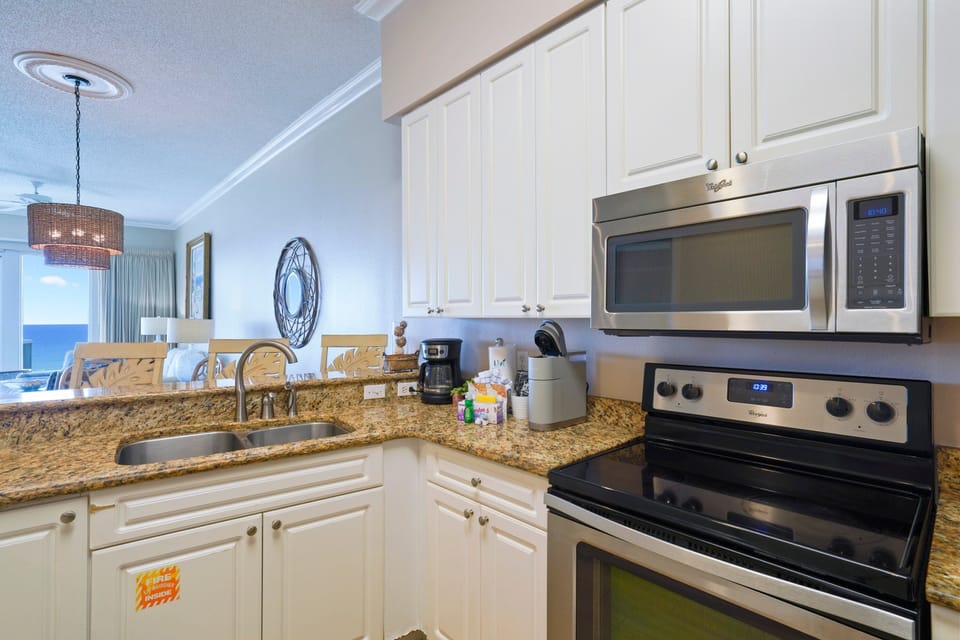 Spacious coastal kitchen with stainless appliances and ocean views