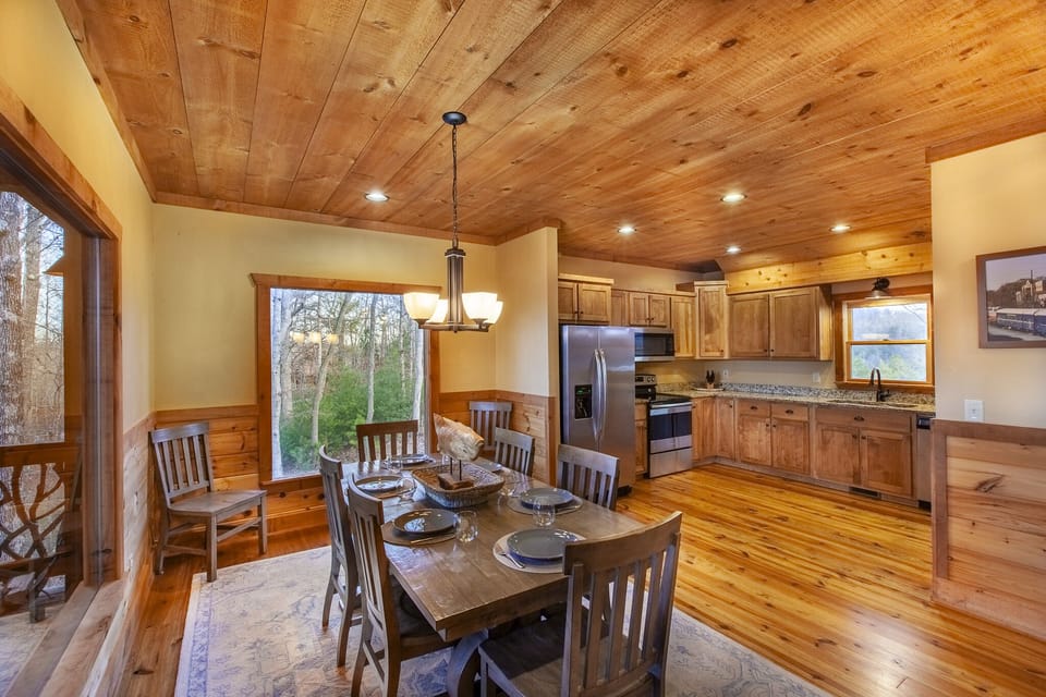 Spacious dining area accommodating eight guests, ideal for family dinners and group gatherings