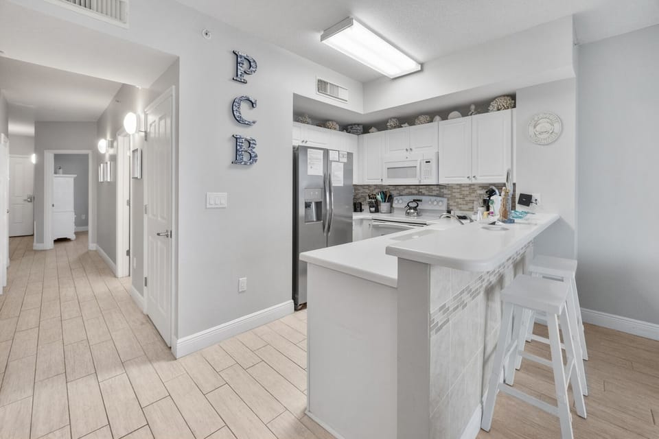 Your bright, fully-equipped kitchen features modern appliances and a breakfast bar perfect for morning coffee or casual meals.