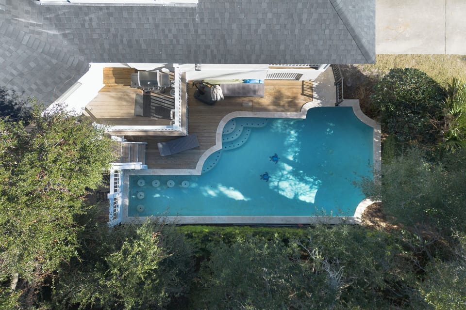 Step outside to your own private oasis featuring a heated pool, perfect for year-round relaxation. The spacious outdoor deck is ideal for lounging, dining, or enjoying the fresh air, and the propane grill makes it easy to cook up a delicious meal.