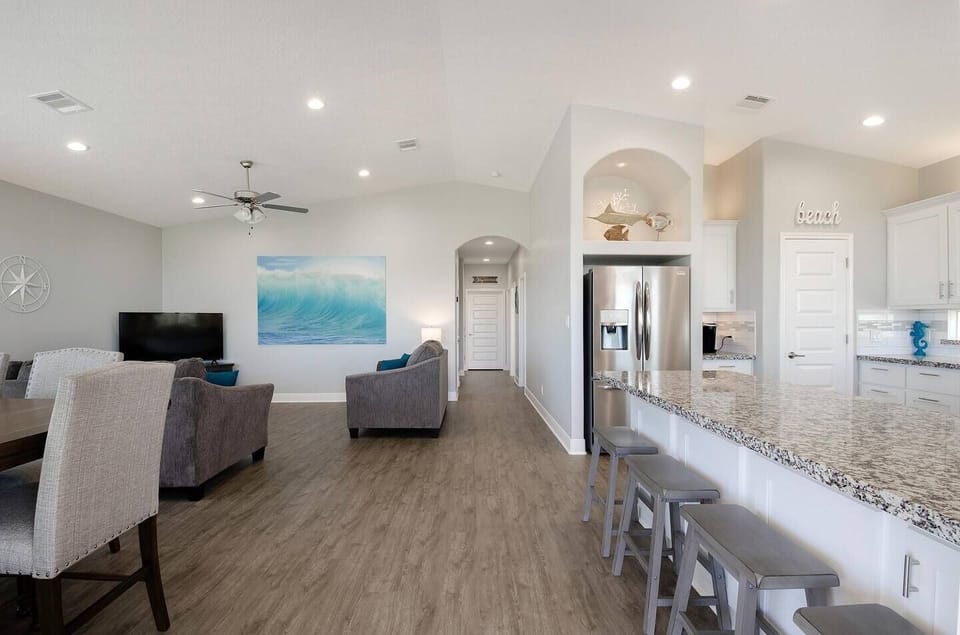 Stylish decor and coastal charm invite you to relax and enjoy the comfort of this open layout home.