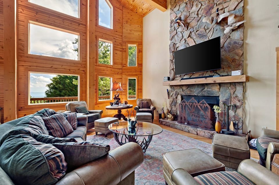 Stone fireplace in the living room with smart TV: