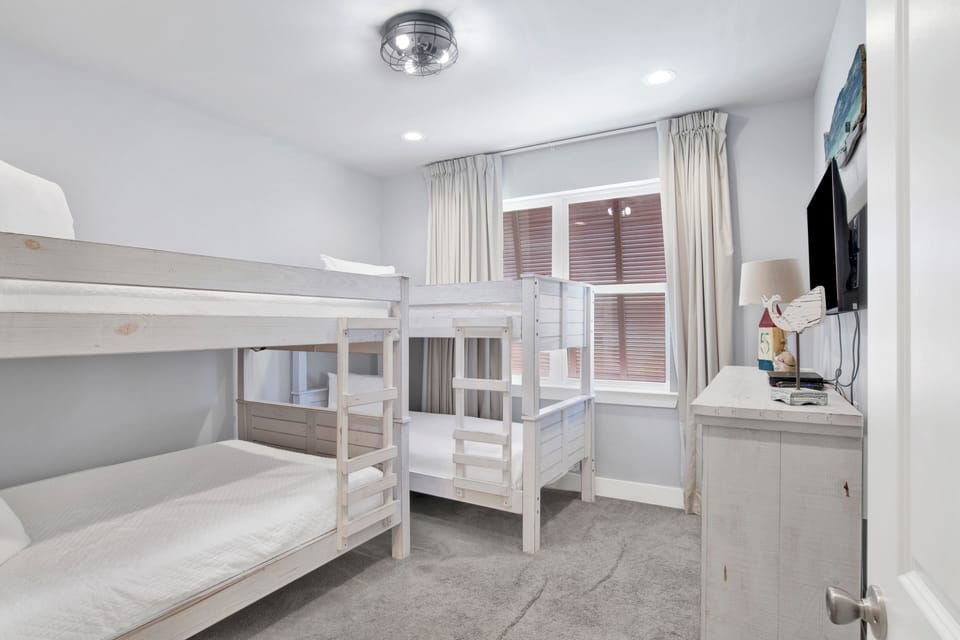 Bedroom 4 offers a private bathroom, TV, Full bunk bed and Twin bunk bed, sleeps 6