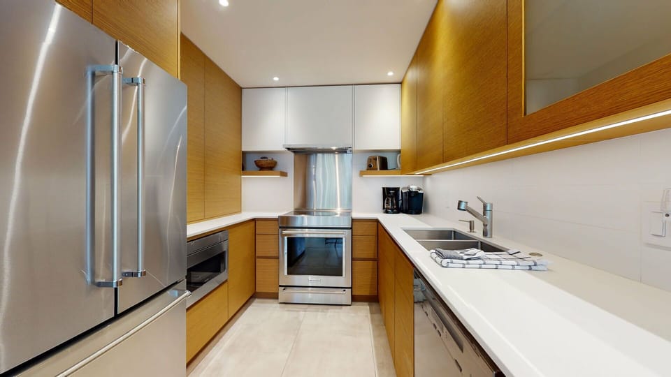 A modern backsplash and under-cabinet lighting bring style and function together.