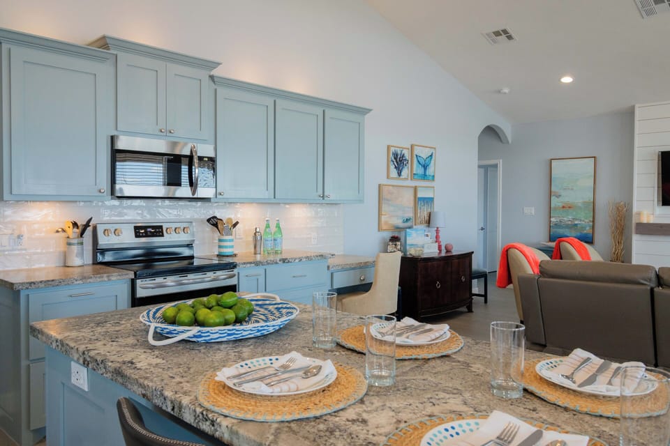 This grand granite island is more than a kitchen feature—it's the perfect hub for laughter, coffee, and late-night chats.