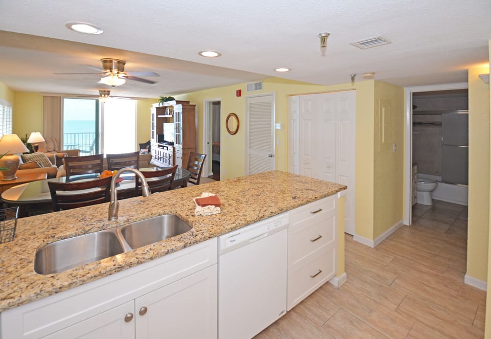 Kitchen with laundry closet just off guest bath