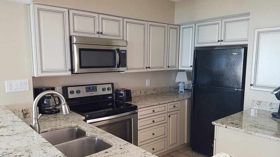 Full kitchen with self clean oven, microwave, refrigerator, dishwasher