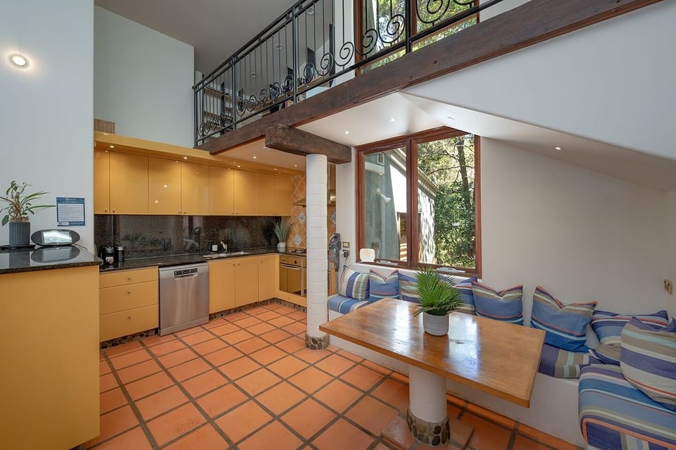 Gourmet kitchen at 20 Little Cove with dual ovens and breakfast counter seating.