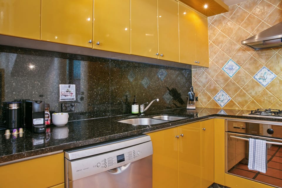 Gourmet kitchen at 20 Little Cove with dual ovens and breakfast counter seating.