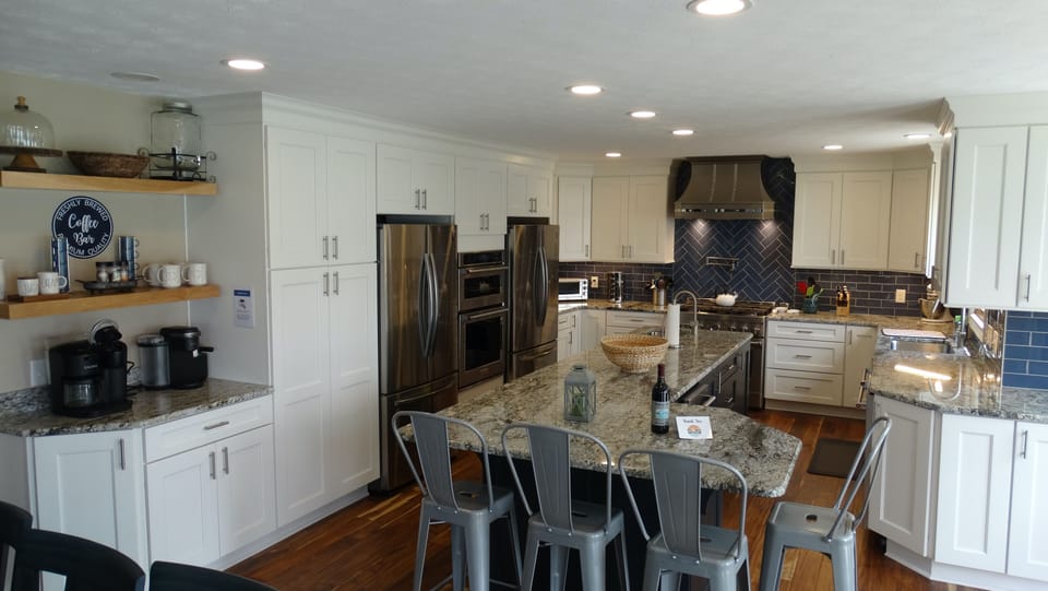 Two full size refrigerator/freezers to go along with the fridge in lower level.