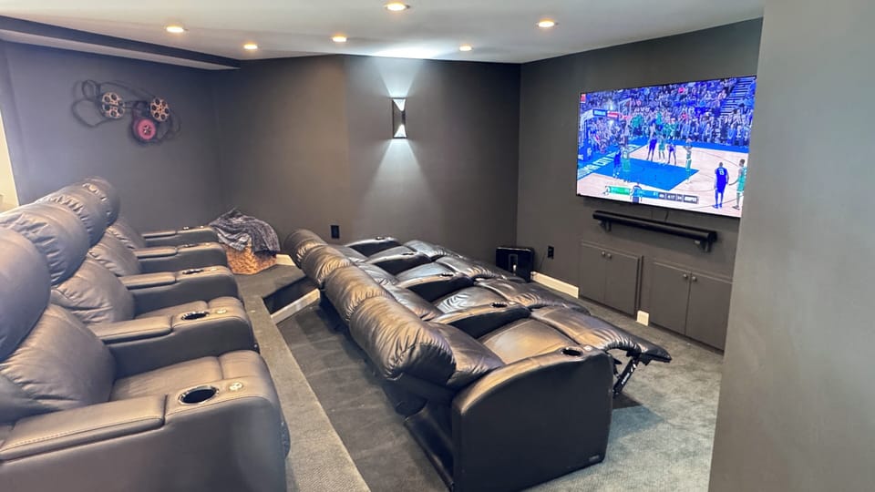 Theatre Room with 65" HD Smart TV.