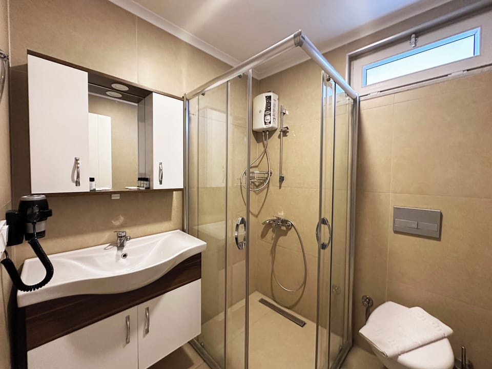 Shower, rainfall showerhead, designer toiletries, hair dryer