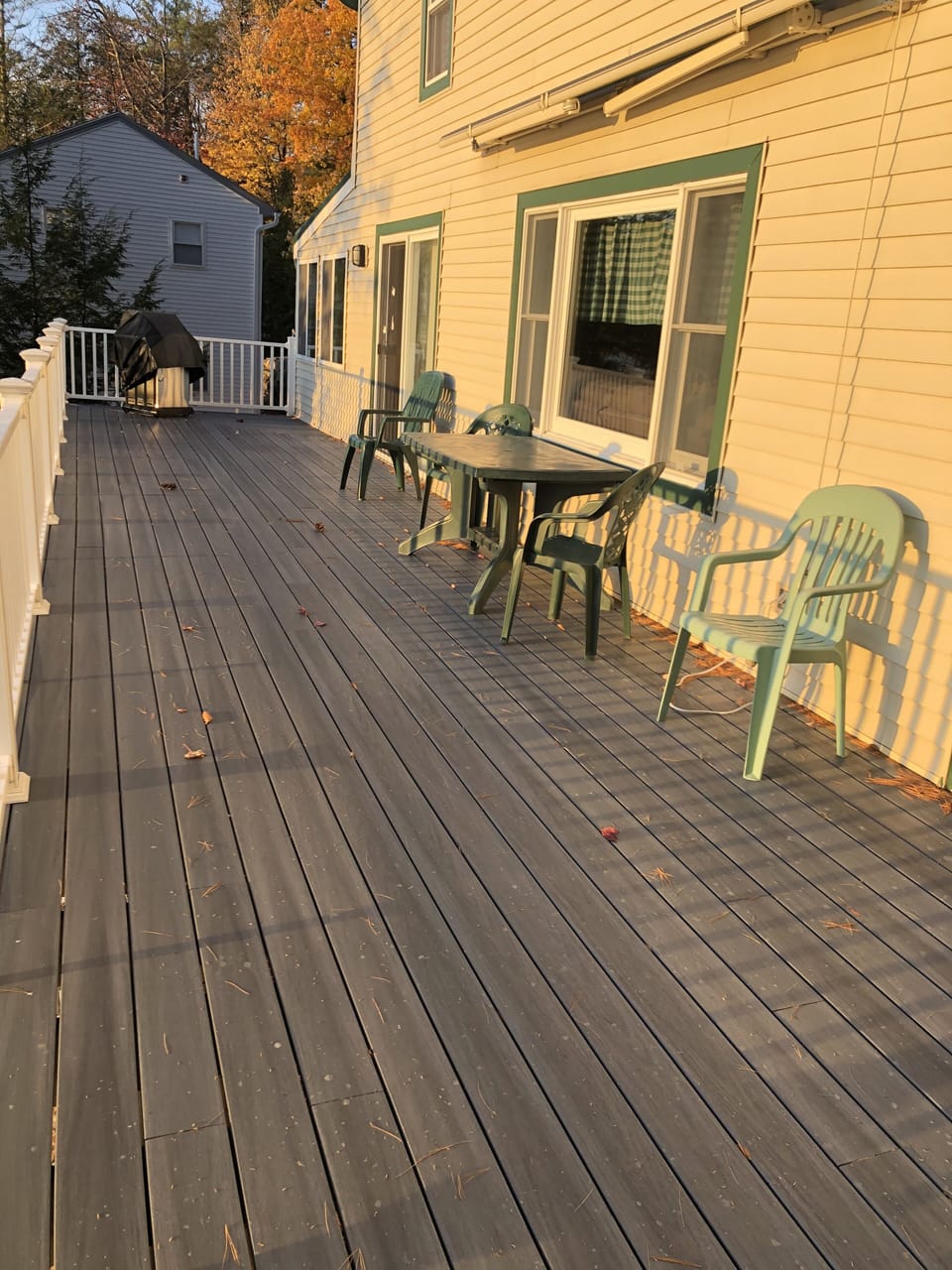 expansive second story porch with grill and expandable awning