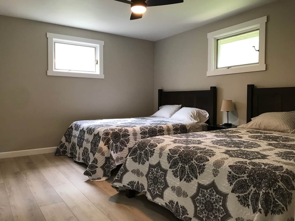 two queen beds in large bedroom